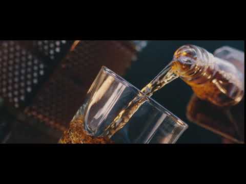 4K person pouring whiskey into glass dutch angle   Stock Video Footag