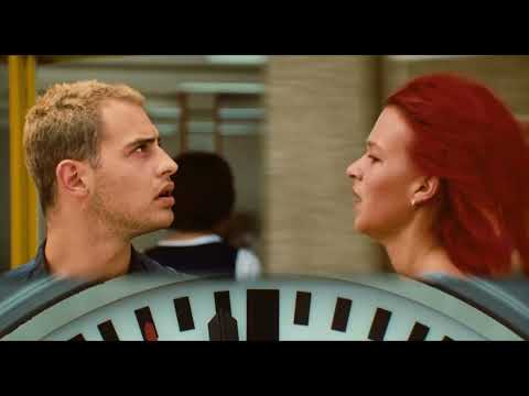 Trailer collage — street-level tracking, a bank lobby crash, and the red-haired streak against yellow trams