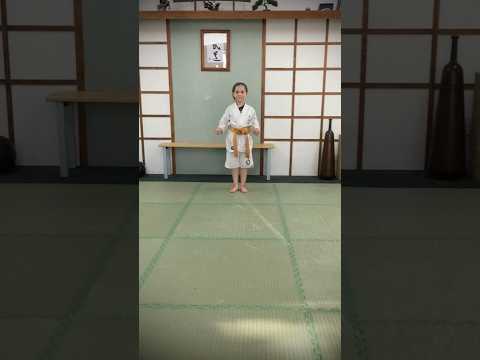 A young Rosalie, age 6. In our Margate Dojo. Practicing a Kata (Pinan San) traditional Karate form.