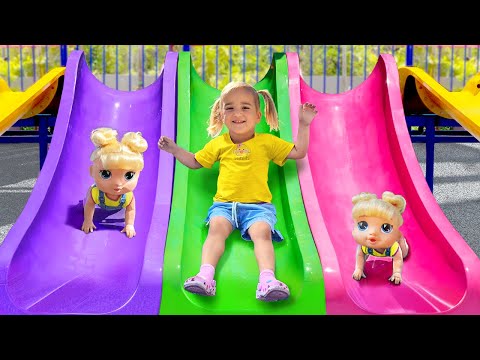 Alice and Baby Doll Play in the Outdoor Playground