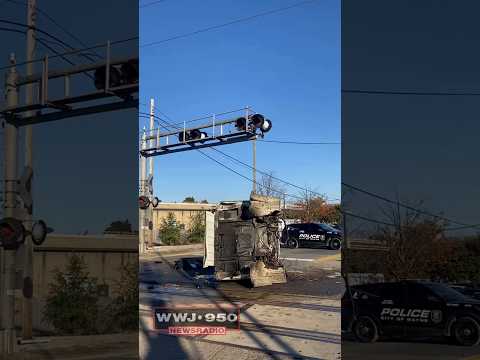 TRAIN CRASHES INTO GARBAGE TRUCK