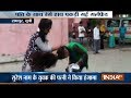 Furious wife seen beating her husband's mistress