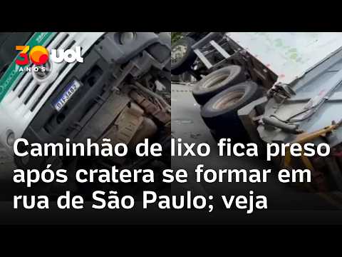 Caminhão de lixo fica preso após cratera se formar em rua de Osasco