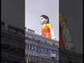GIANT DOLL KOKOLA SQUID GAME WALKS AROUND IN THE CITY