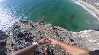 Man is brutally shredded by sharp rocks below while cliff jumping