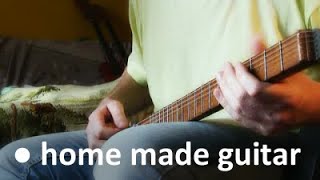 Guitar made of an axe handle