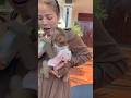 Seeing its mother drinking milk, the little monkey ran over to drink along with her.