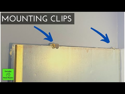 Part of a video titled Removing a Bathroom Mirror | Mounting Clips or Brackets - YouTube