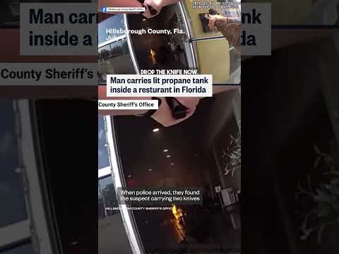 Man carries lit propane tank into Florida restaurant