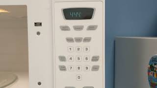 How to set the clock on a Whirlpool microwave oven model # AMV1150VAW-5
