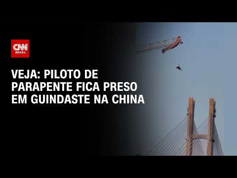 Piloto de parapente fica preso em guindaste na China; veja imagens | CNN BRASIL