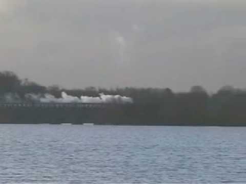 Great Central Railway steam trains passing from across the resevoir