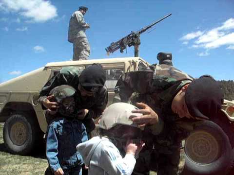 Christina, friend Miriam, soldiers and Humvee