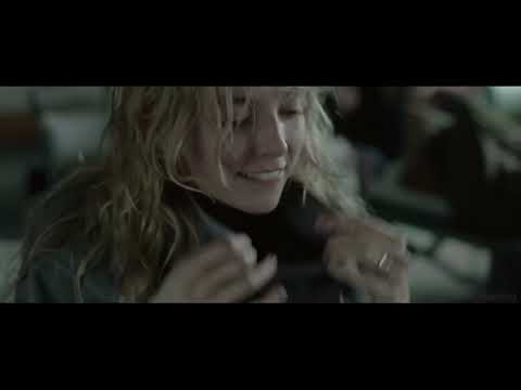 Trailer frame: close-up of mother and sleeping infant; strings and soft synth pulse underline breath