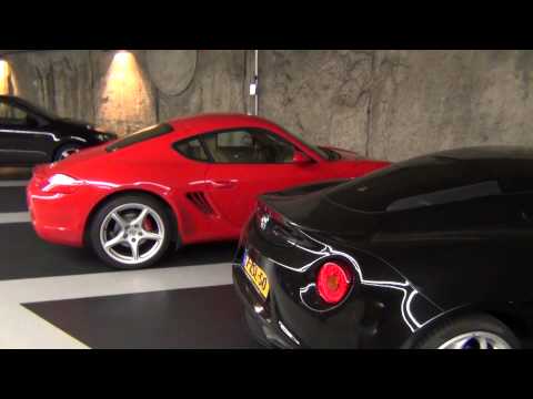 Red Porsche Cayman vs Alfa Romeo 4C in parking