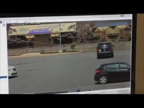 Surveillance video from eastern Pennsylvania shows a train's cars suddenly topple over. Police said the Delaware-Lackawanna Railroad train carrying lumber and sand used for fracking derailed at about noon Tuesday in Dickson City. (April 10)