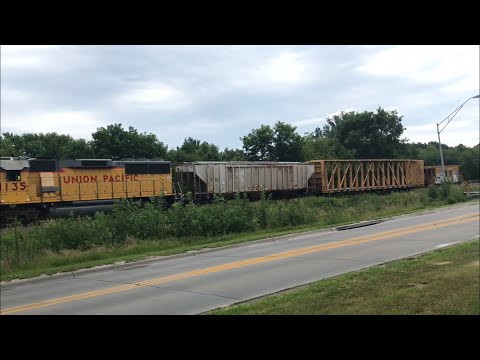 UP GP60 leading Woody Local with Caboose