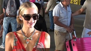 Paris Hilton Takes Dozens Of Photos With Fans At LAX
