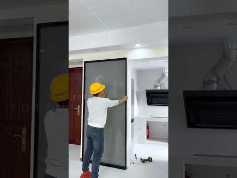 Trackless ghost door installation.#slidingdoors #glassdoors #foldingdoor #frenchdoors