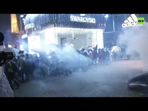 Hong Kong police disperses a crowd of protesters with teargas