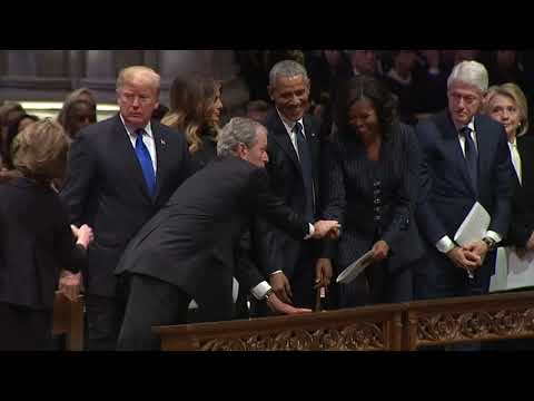 George W Bush sneaks Michelle Obama candy before father's funeral