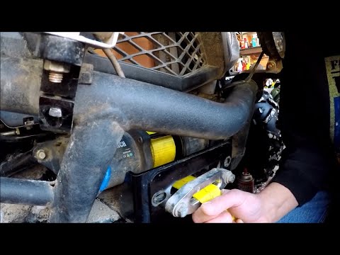 Installing a strap onto a winch.