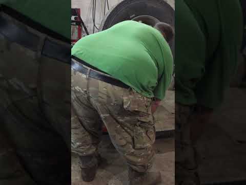 Amateur using Corghi Ag52 L removing semi Tire