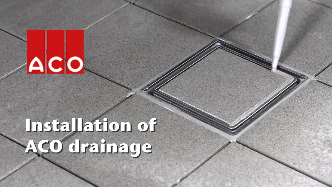 ACO plastic commercial gully installed with tiled floor