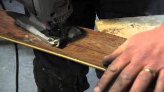 Step 3 - cutting the first row of laminate flooring