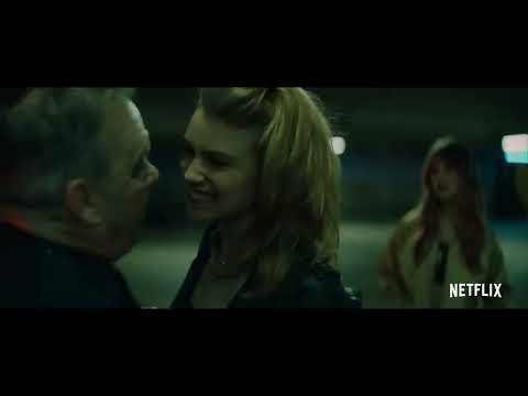 Night Teeth official trailer still: neon-lit Los Angeles at midnight as a black town car pulls to the curb