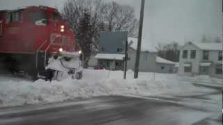 preview picture of video 'CN Train plows through a snow bank in Stephenson, Michigan'