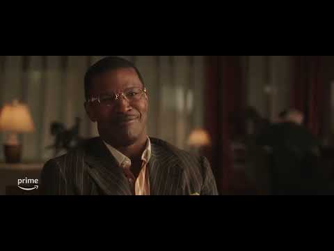 The Burial (2023) official trailer frame featuring Jamie Foxx and Tommy Lee Jones in courtroom attire