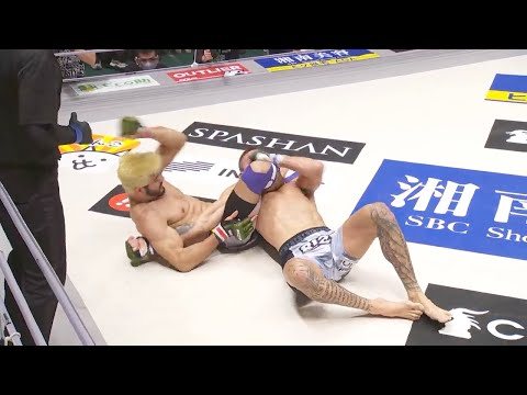 相手の予想をはるかに超えて三角絞めを決めてしまう。ホベルト・サトシ・ソウザ
