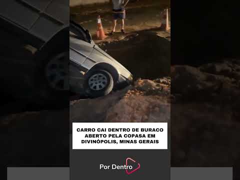 CARRO CAI DENTRO DE BURACO ABERTO PELA COPASA EM DIVINÓPOLIS, MINAS GERAIS