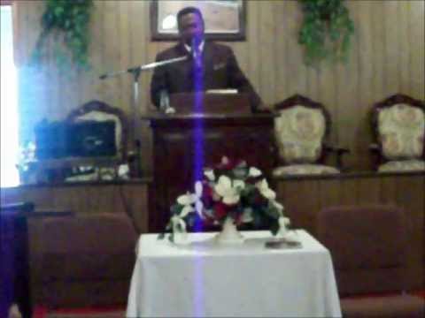 Bishop Frederick B. Allen singing```Minister M.D. Adams organist
