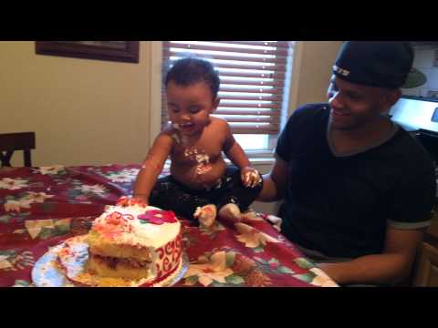 Noely playing with the Cake