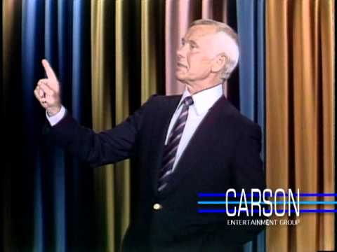 Johnny Carson tries to get through a joke with help from his staff