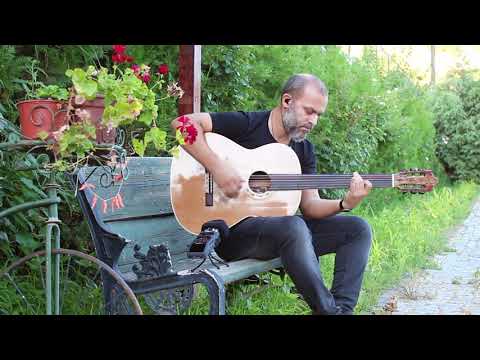 Cenk Erdogan  plays Baritone Fretless Acoustic Guitar