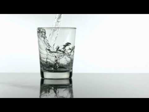 slow motion pouring glass of water