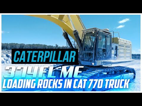 Big excavator working! CAT 374FLME loading rocks in CAT 770