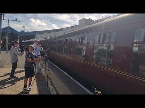 here is maroon class 47802 brings in 45690 Leander into platform 10 from Bristol east depot