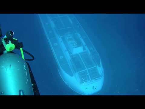 Submarine goes under diver