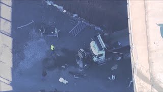 Two hurt after truck goes off Boston overpass onto ground below