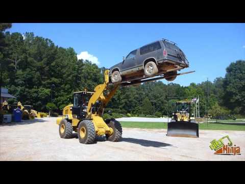 Cat 938M Wheel Loader Lifting SUV With Car Forks