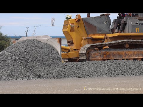 Skills Driver Komatsu D41E Bulldozer Grading Gravel Road With Hyundai 24 Ton Trucks Dumping Gravel