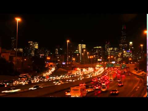 Chicago Heavy Freeway Traffic -Chicago Skyline Background Nighttime - Time lapse 4K