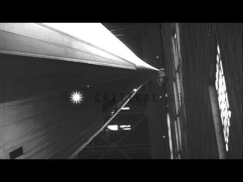 German  Zeppelin Hindenburg (LZ-129) parked in hangar as people look at it. Lakeh...HD Stock Footage