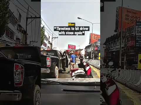 Road Rage Biker Throws Stone at Man's Truck