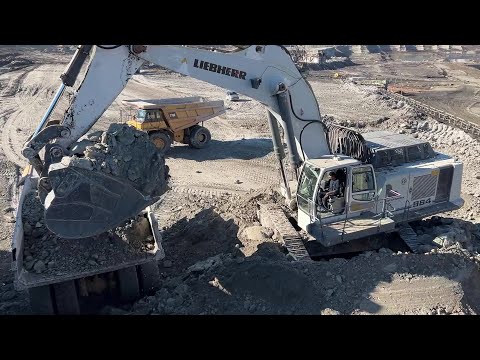 Liebherr 984 Excavator Loading Caterpillar 775E And 773D Dumpers - Labrianidis Mining Works