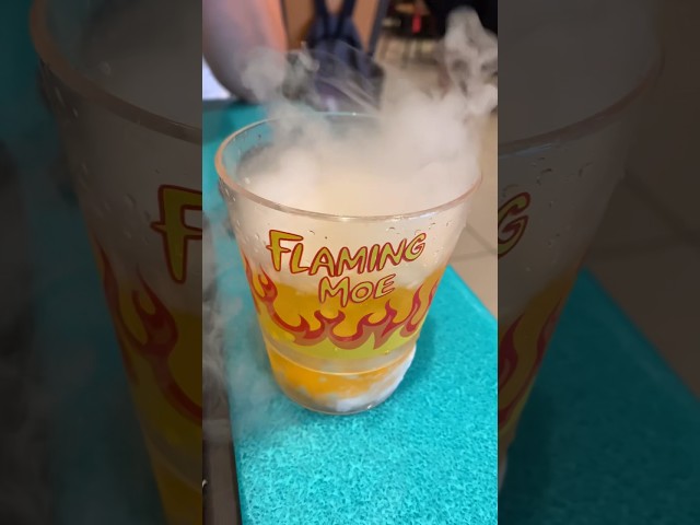 Vídeo relacionado con Flaming Moe (Neon Series) - Camiseta Manga Corta (Negro, L)